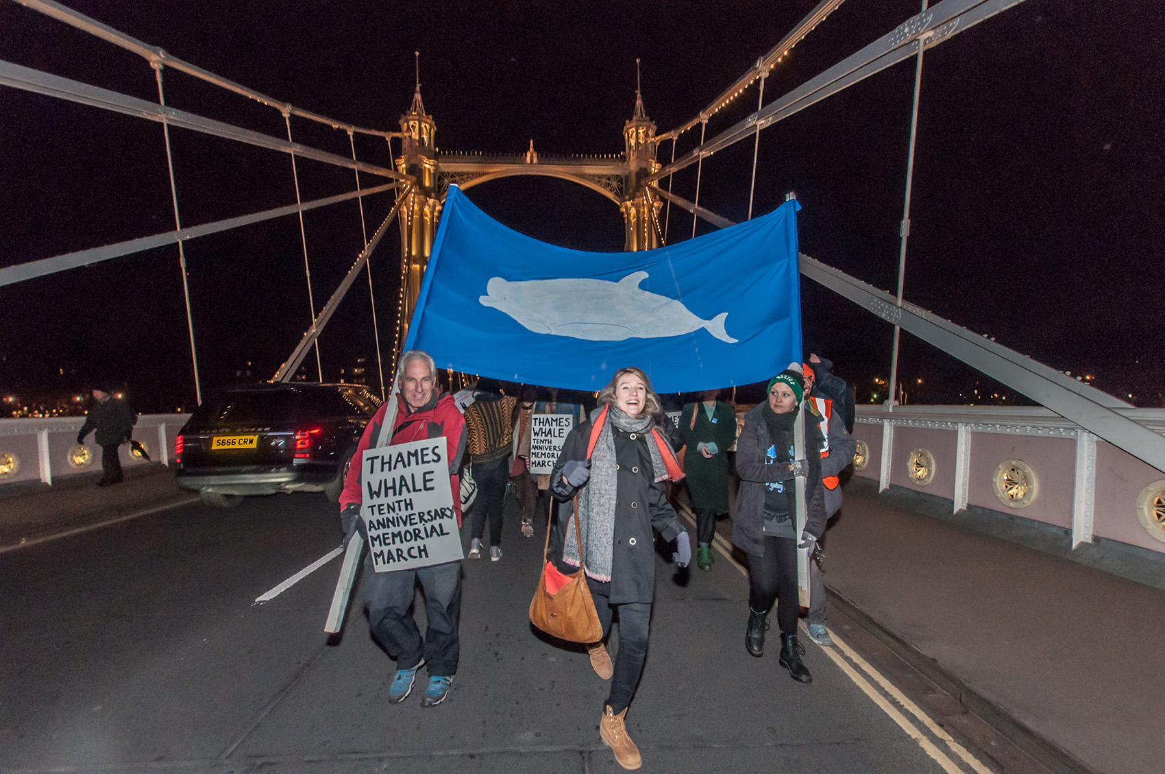 People marching with whale banner at the Ten Year Thames Whale Memorial March