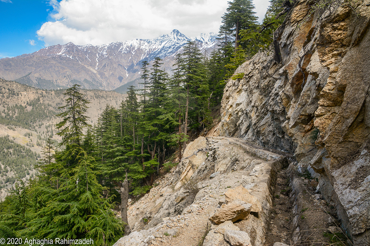 An irrigation channel in the side of a mountain in the Himalayas is designed to bring water down from far-away glaciers