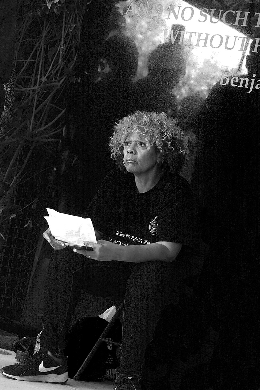 black and white candid portrait of local (Riverside, CA) President of the NAACP getting ready to make a fiery speech at a rally downtown