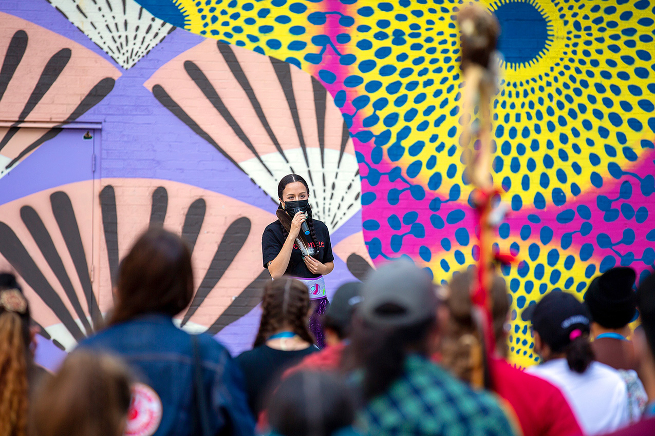 A woman speaks to the crowd during the public art performance “Whose Lakefront” protesting a history of colonialism in the US