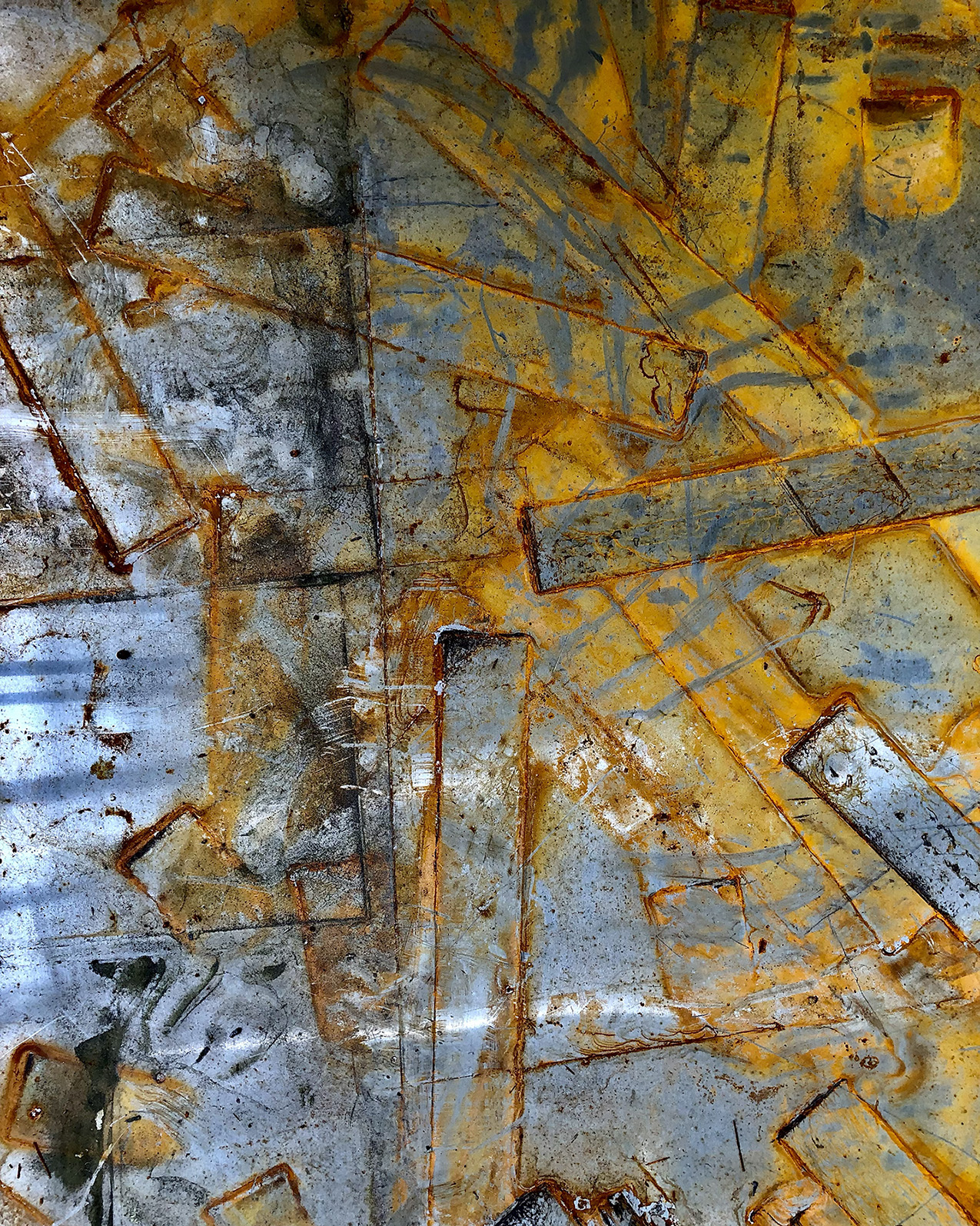 vertical abstract photograph of metal sheets overlaid with metal strips in various stages of rust