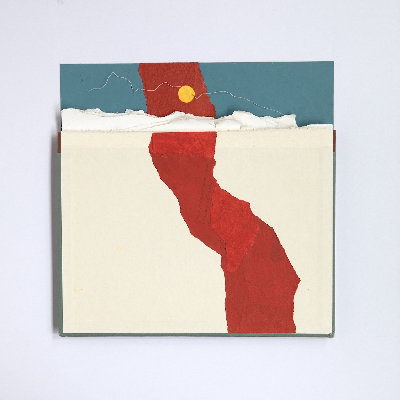 torn paper collage reminiscent of a landscape with a blue sky, yellow sun, and bold red river running from top to bottom