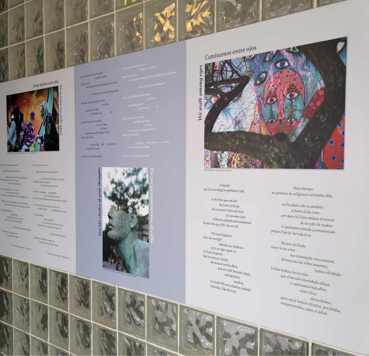 triptych panel featuring three photos, each accompanied by a poem in two languages, hung on a glass block wall